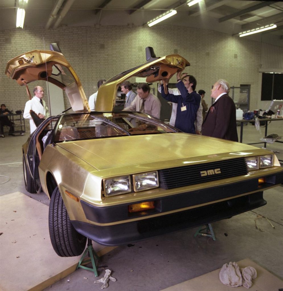 Gold car assembly with Dick Kendall (far right) | DeLoreanDirectory.com